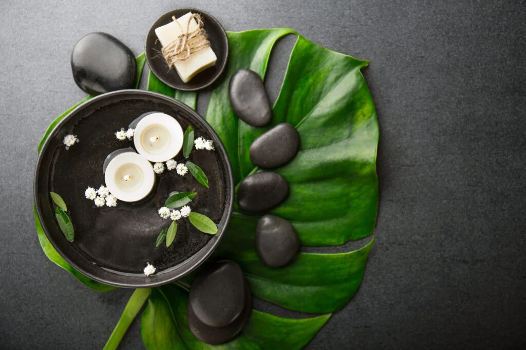 Warm stone massage therapy at a private villa in Bali